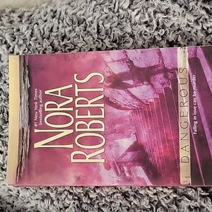 Nora Roberts paperback book, Dangerous Falling in love can be murder...